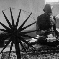 Gandhi at spinning wheel